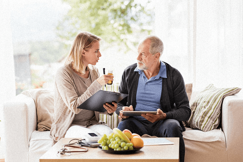 caregiver and old man talking