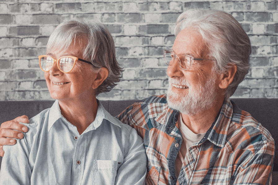 two happy senior couples smiling 