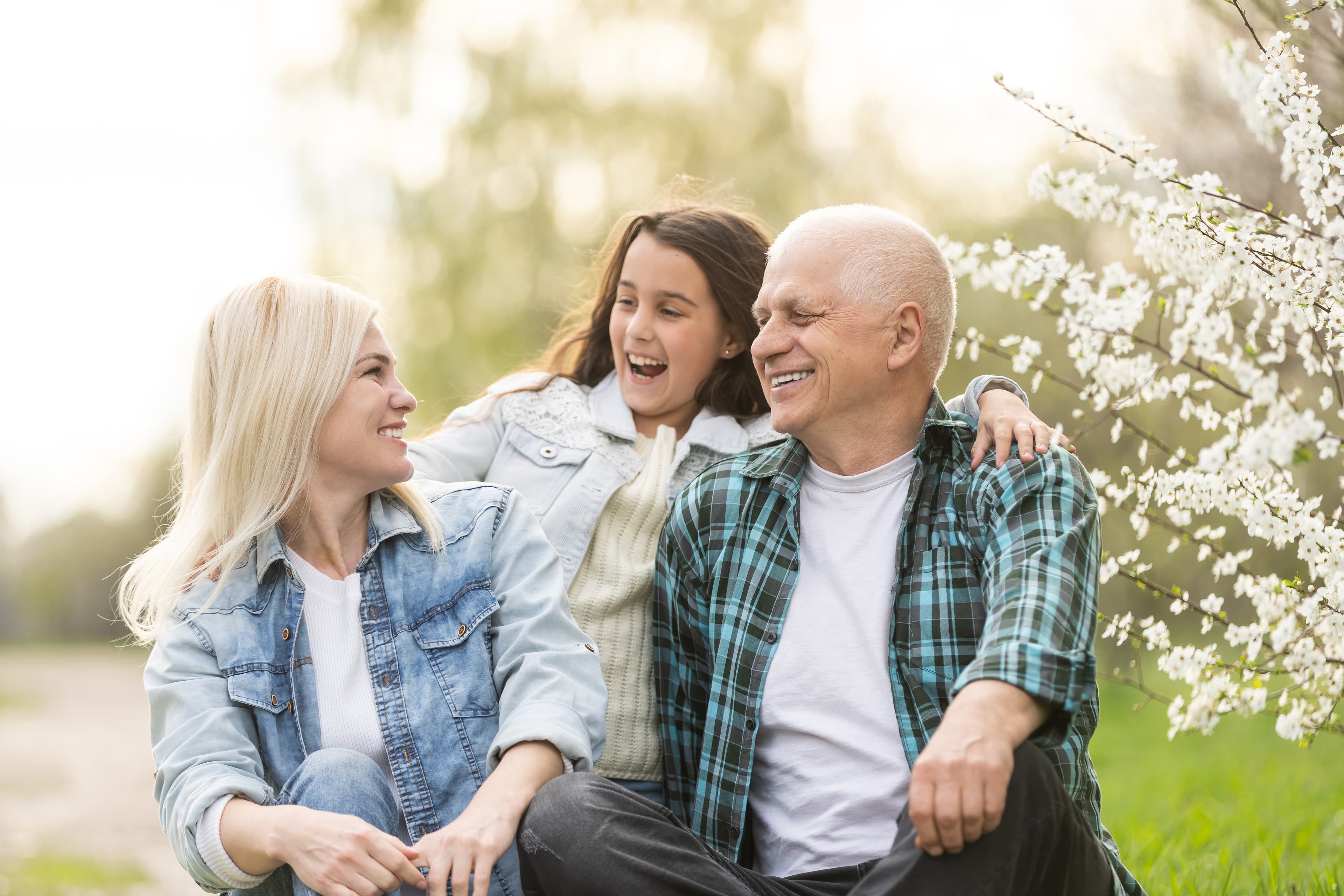 happy family sitting together with elderly