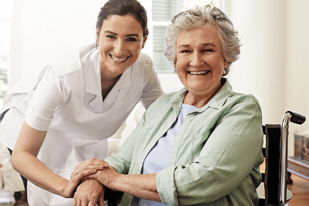 senior woman smiling with nurse