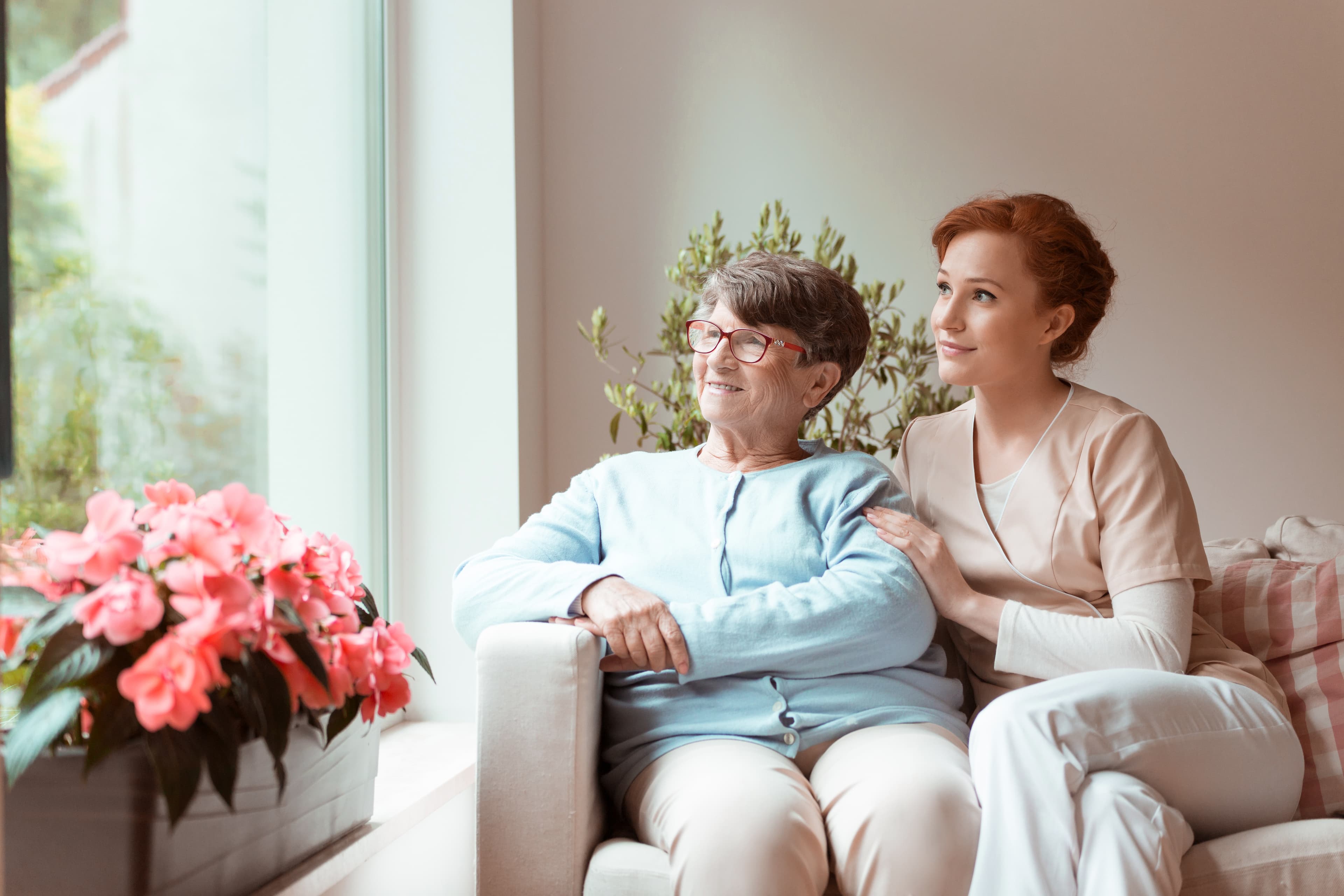 Home health aide providing in-home care to a patient